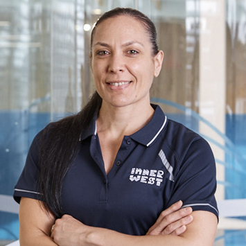 Personal trainer Ananda Veehala close up with arms crossed smiling